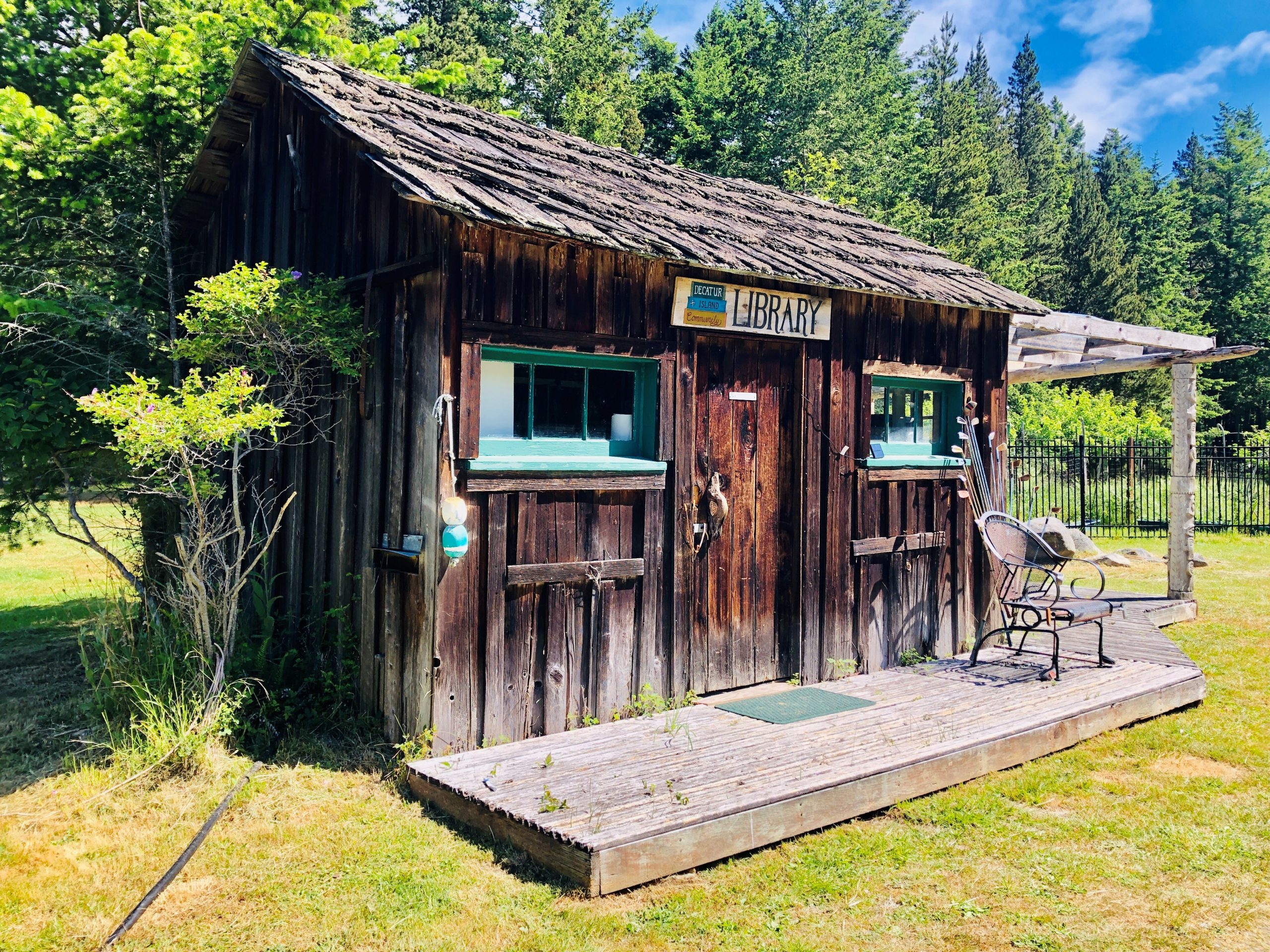 A small. weathered wood shed serves as the community library on Decatur Island