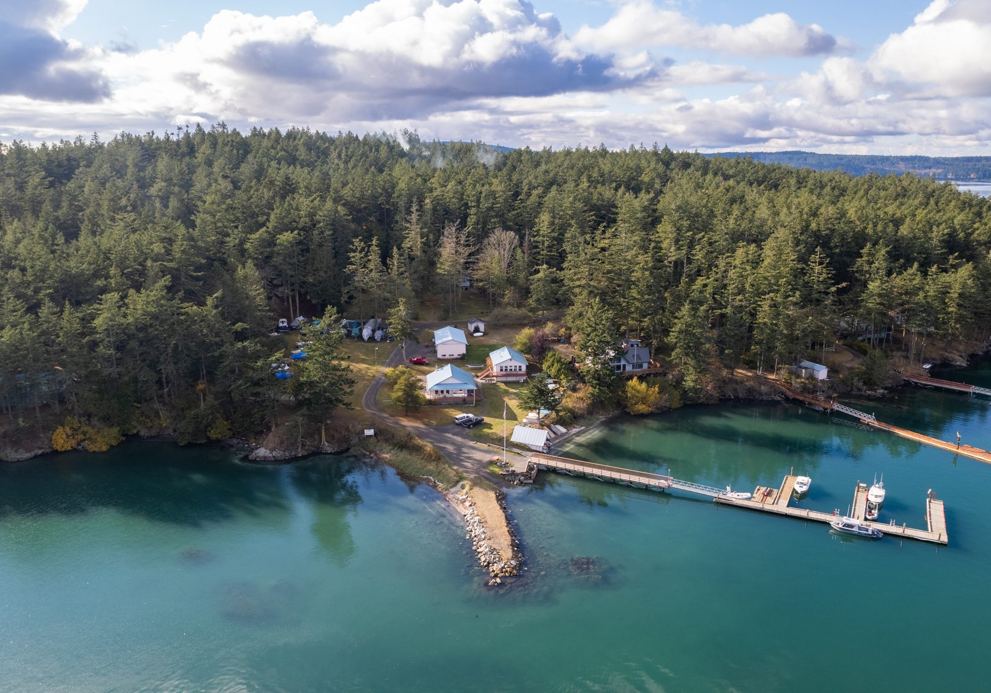 Aeiral view of Center Island from the North. It shows the club house, caretakers cabin, community dock and boat launch